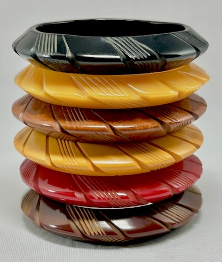 BB413 slash carved bakelite saucer bangles